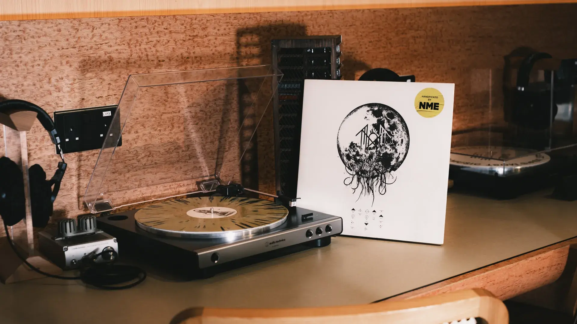 A turntable and vinyl record at a listening station